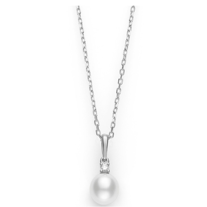 Mikimoto 18 karat white gold diamond & pearl necklace. The necklace contains 1 round brilliant prong set diamond with one white 7.5x8mm cultured pearl drop. The necklace has a flat curb link design measuring 18
